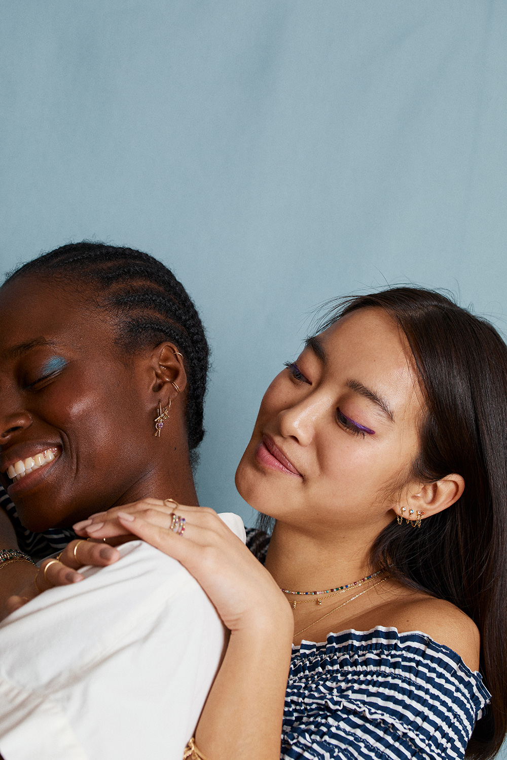 Lookbook photoshoot. Two women bounding over jewelry and creativity. yay paris.